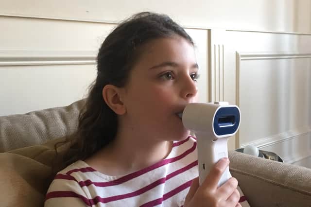 The device is used to measure CO2 in exhaled breath during normal relaxed breathing. Picture: contributed.