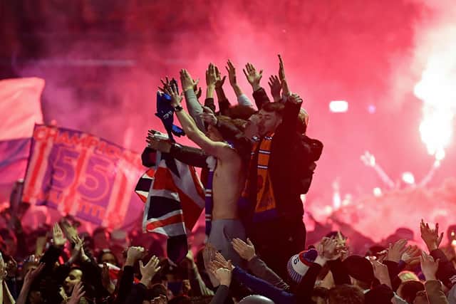 Rangers fans gather in Glasgow's George Square to celebrate the club winning the Scottish Premiership (Picture: Jeff J Mitchell/Getty Images)