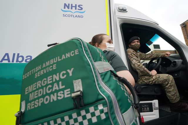 Scottish Ambulance Service Paramedic Amy young alongside Private Guy Spiers from 68 Squadron of 7th Regiment Royal Logistic Corps . PA Photo. Photo credit should read: Andrew Milligan/PA Wire