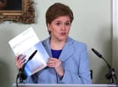 Nicola Sturgeon unveils her 'scene setter' at Bute House last week  (Photo by Russell Cheyne - Pool/Getty Images)