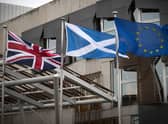 The Union flag, Saltire and EU flag fly outside the Scottish Parliament in Edinburgh. Picture: PA