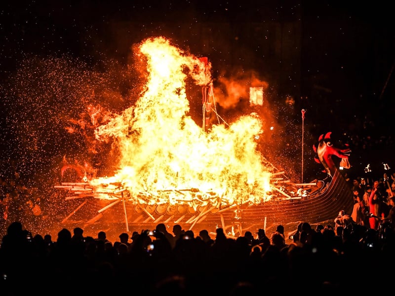 Up Helly Aa celebrates the influence of the Scandinavian Vikings in the Shetland Islands and culminates with up to 1,000 'guizers'throwing flaming torches into their Viking longboat and setting it alight later in the evening. (Photo by Andy Buchanan / AFP)