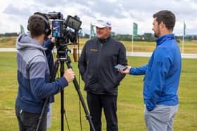 Paul Lawrie, the 1999 Open champion at Carnoustie, conducts an interview ahead of the Senior Open presented by Rolex. Picture: Kenny Smith/Getty Images.