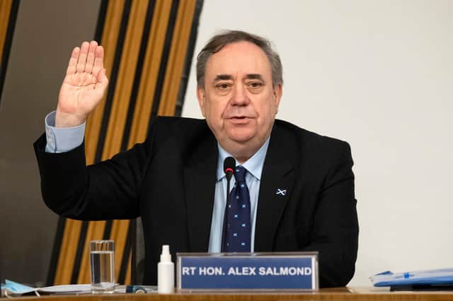 Alex Salmond is sworn in before giving evidence to the Scottish Parliament committee examining the government's handling of harassment allegations against him