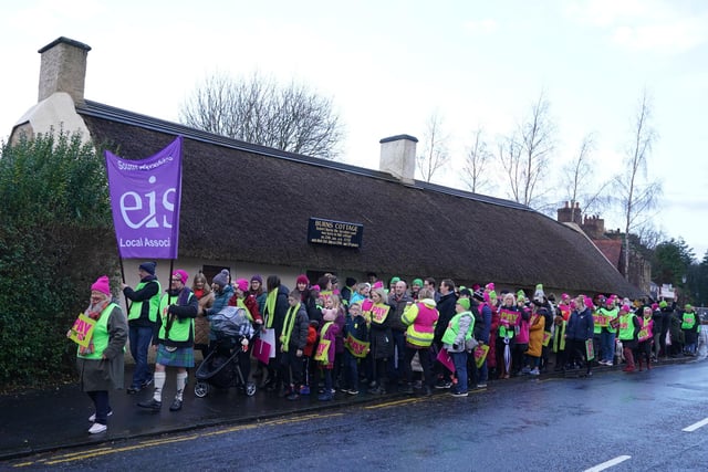 Striking teachers from the EIS gather on the anniversary of Robert Burns' birth in 1759 outside the cottage in Alloway, Ayrshire
