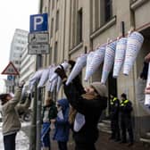 Campaigners hang notes that read "Right for education is a basic human right", in different languages outside Berlin's education administration building to demand access to local schools for refugees. According to Fluechtlingsrat-Berlin, an organisation that campaigns for refugee rights, at least 1,500 refugee children and youth are still waiting to be allotted a spot in a local school, despite promises from city officials and German law that requires refugees to be given education.