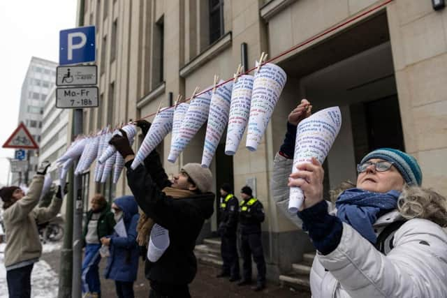 Campaigners hang notes that read "Right for education is a basic human right", in different languages outside Berlin's education administration building to demand access to local schools for refugees. According to Fluechtlingsrat-Berlin, an organisation that campaigns for refugee rights, at least 1,500 refugee children and youth are still waiting to be allotted a spot in a local school, despite promises from city officials and German law that requires refugees to be given education.