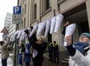 Campaigners hang notes that read "Right for education is a basic human right", in different languages outside Berlin's education administration building to demand access to local schools for refugees. According to Fluechtlingsrat-Berlin, an organisation that campaigns for refugee rights, at least 1,500 refugee children and youth are still waiting to be allotted a spot in a local school, despite promises from city officials and German law that requires refugees to be given education.