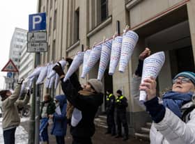 Campaigners hang notes that read "Right for education is a basic human right", in different languages outside Berlin's education administration building to demand access to local schools for refugees. According to Fluechtlingsrat-Berlin, an organisation that campaigns for refugee rights, at least 1,500 refugee children and youth are still waiting to be allotted a spot in a local school, despite promises from city officials and German law that requires refugees to be given education.