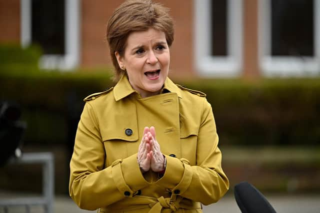 Scotland's First Minister Nicola Sturgeon speaks to the media after a visit to a Burnside chemist as she campaigns in Rutherglen. Picture: Jeff J Mitchell/AFP via Getty Images