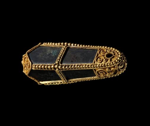 An elongated gold pendant from the Viking age Galloway Hoard which will feature in The Galloway Hoard: Viking-age Treasure exhibition at the National Museum of Scotland next February.
