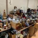 The Scout group collects items to sell in the week leading up to their sale