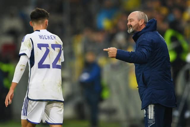 Scotland manager Steve Clarke gives instructions to Aaron Hickey during the match against Ukraine.