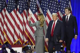Donald Trump arrives on stage with his wife Melania and their son Barron.