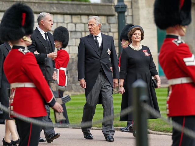Former Prime Minister Sir Tony Blair (centre) and wife Cherie arrive for the Committal Service for Queen Elizabeth II held at St George's Chapel in Windsor Castle, Berkshire. Picture date: Monday September 19, 2022.