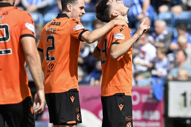Dundee United's Dylan Levitt (R) celebrates making it 1-0 with Liam Smith. (Photo by Rob Casey / SNS Group)