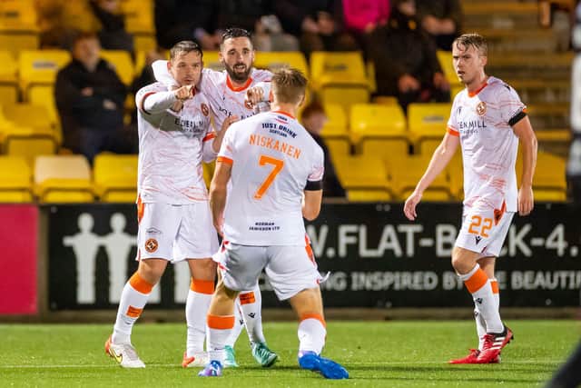 Dundee United's Peter Pawlett (left) celebrates his equaliser at Livingston (Photo by Roddy Scott / SNS Group)