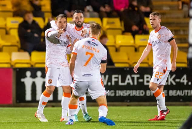 Dundee United's Peter Pawlett (left) celebrates his equaliser at Livingston (Photo by Roddy Scott / SNS Group)