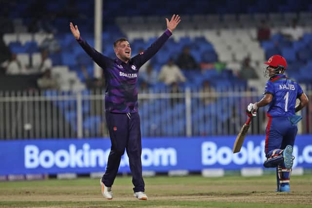 Scotland's Mark Watt appeals unsuccessfully for the wicket of Afghanistan's Rahmanullah Gurbaz during the Cricket Twenty20 World Cup match between Afghanistan and Scotland in Sharjah, UAE, Monday, Oct. 25, 2021. (AP Photo/Aijaz Rahi)