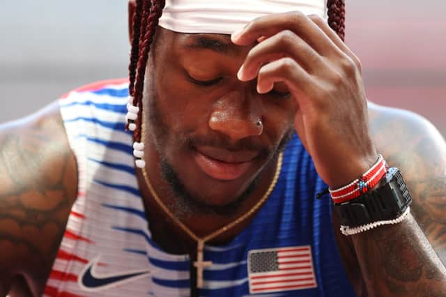 Cravon Gillespie reacts after the USA finish sixth in the 4x100m heats