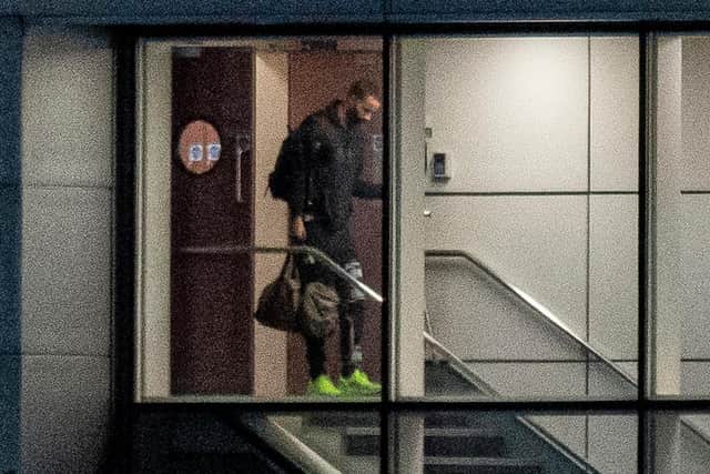 Christopher Jullien arrives back to Glasgow Airport with the rest of the Celtic squad following the trip to Dubai that resulted in a positive Covid-19 test for the Frenchman that set off a calamitous chain of events for the club. (Photo by Ross MacDonald/SNS Group).