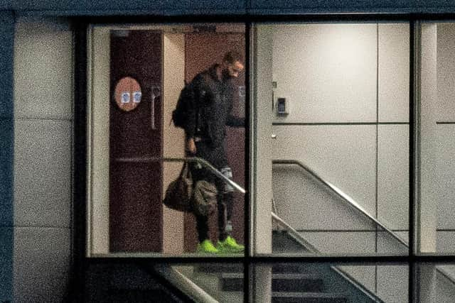 Christopher Jullien arrives back to Glasgow Airport with the rest of the Celtic squad  following the trip to Dubai  that resulted in a positive Covid-19 test for the Frenchman that set off a calamitous chain of events for the club. (Photo by Ross MacDonald/SNS Group).