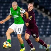 Hibs' Alex Gogic tussles with Hearts' Andy Halliday during Saturday's Scottish Cup semi-final. Photo by Ross Parker/SNS Group