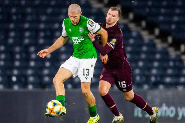Hibs' Alex Gogic tussles with Hearts' Andy Halliday during Saturday's Scottish Cup semi-final. Photo by Ross Parker/SNS Group