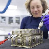 Conservator Diana de Bellaigue removes tarnish from the Mary, Queen of Scots casket. PIC: Duncan McGlynn.