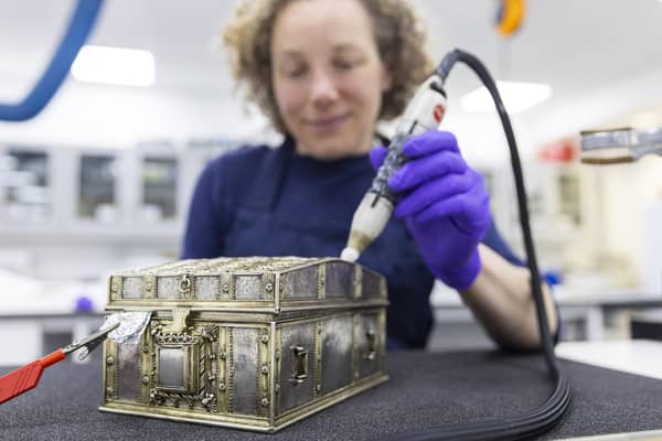 Conservator Diana de Bellaigue removes tarnish from the Mary, Queen of Scots casket. PIC: Duncan McGlynn.