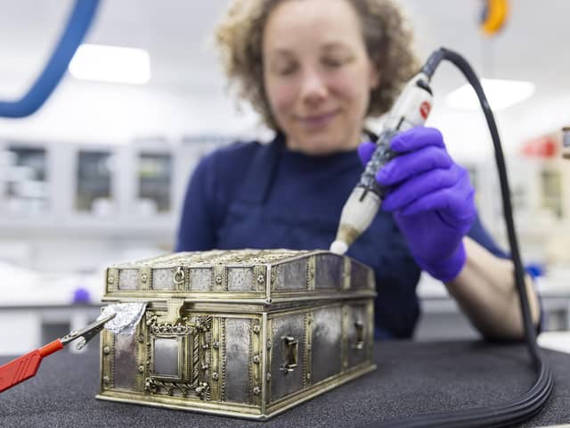 Conservator Diana de Bellaigue removes tarnish from the Mary, Queen of Scots casket. PIC: Duncan McGlynn.