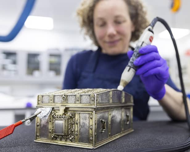 Conservator Diana de Bellaigue removes tarnish from the Mary, Queen of Scots casket. PIC: Duncan McGlynn.