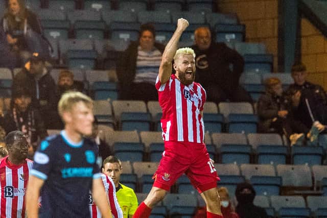 Shaun Rooney celebrates after putting St Johnstone ahead at Dens Park. (Photo by Ross Parker / SNS Group)