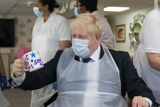Prime Minister Boris Johnson during a visit to Westport Care Home in Stepney Green, east London, ahead of unveiling his long-awaited plan to fix the broken social care system. PA Wire