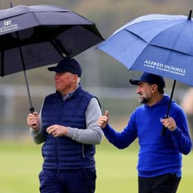 Martin Slumbers, chief executive of The R&A and LIV Golf chairman Yasir Al-Rumayyan chat during the opening round of the Alfred Dunhill Links Championship at St Andrews. Picture: Stephen Pond/Getty Images.