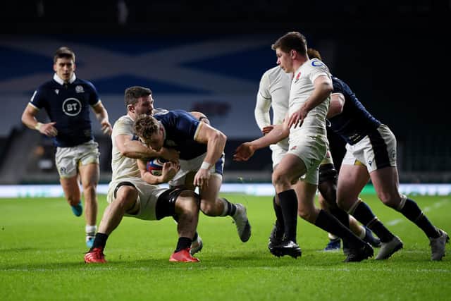 Duhan van der Merwe breaks past Mark Wilson of England to score a try for Scotland at Twickenham. Picture: Mike Hewitt/Getty Images