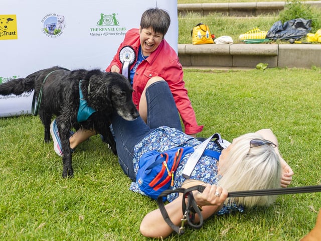 Kura, the Flat coated retriever, with Tess White MSP and Sue Webber attends this year's Holyrood Dog of the Year competition, organised jointly by Dogs Trust and The Kennel Club, Edinburgh. Picture: Euan Cherry/PA Wire