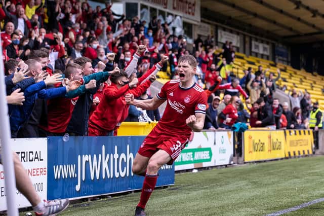 Aberdeen left-back Jack MacKenzie celebrates his late winner against Livingston - it is the 21-year-old's first senior goal (Photo by Alan Harvey / SNS Group)
