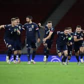 Andy Robertson of Scotland celebrates with his team after his team's victory in the penalty shoot out in the UEFA EURO 2020 Play-Off semi-final match against Israel. (Photo by Ian MacNicol/Getty Images)