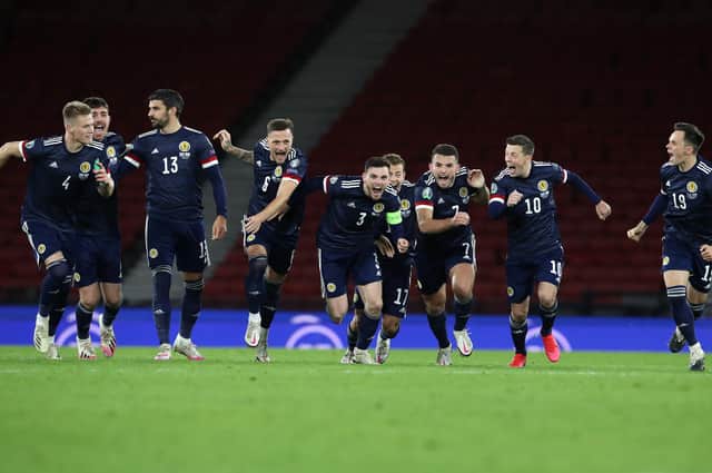 Andy Robertson of Scotland celebrates with his team after his team's victory in the penalty shoot out in the UEFA EURO 2020 Play-Off semi-final match against Israel. (Photo by Ian MacNicol/Getty Images)