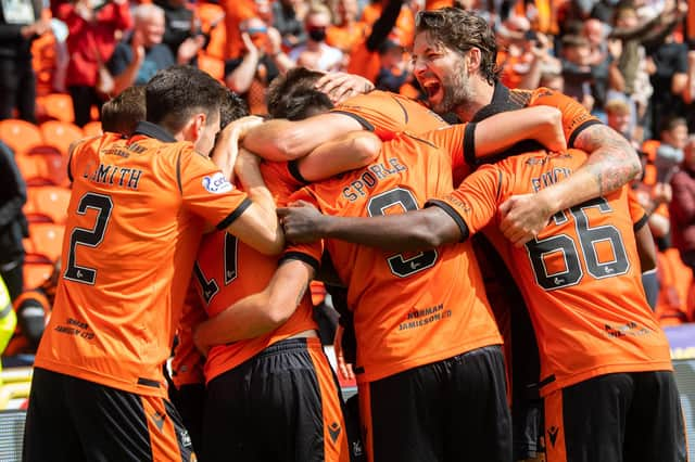 Charlie Mulgrew, far right, joins in the Dundee United celebrations after defeating Rangers 1-0 at Tannadice.