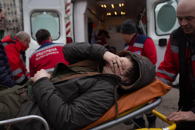 A Ukrainian serviceman who suffered leg wounds during shelling near Irpin receives medical help on March 6, 2022 in Kyiv, Ukraine. Photo by Anastasia Vlasova/Getty Images
