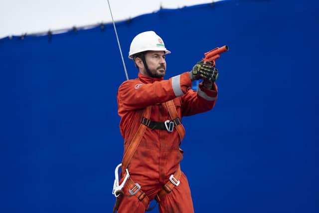Martin Compston, who stars as communications operator Fulmer in The Rig, during filming of scenes in Leith Docks.