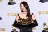 US singer Olivia Rodrigo poses with her various awards during the 64th Annual Grammy Awards. Photo: Patrick T. FALLON / AFP via Getty Images.