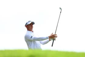 Grant Forrest plays his shot from the fourth tee in Singapore.