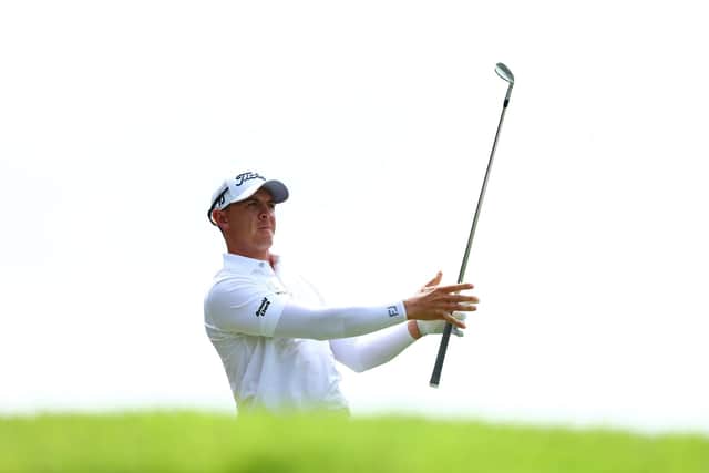 Grant Forrest plays his shot from the fourth tee in Singapore.