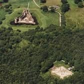 The 'new' Caerlaverock Castle (top) was built only a short distance away from the original moated mansion, on ground just 7m above normal sea level -- researchers have revealed that both fortifications were affected by storm surges during a period of climate change between 1200 and 1570. Picture: RCAHMS