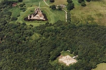 The 'new' Caerlaverock Castle (top) was built only a short distance away from the original moated mansion, on ground just 7m above normal sea level -- researchers have revealed that both fortifications were affected by storm surges during a period of climate change between 1200 and 1570. Picture: RCAHMS