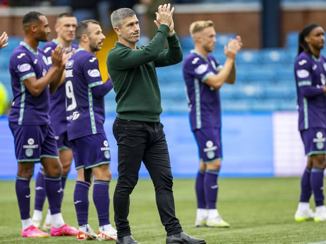 Nick Montgomery and the Hibs players applaud the travelling support following the 2-2 draw at Kilmarnock.