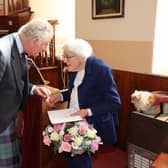 Church organist Mary Edmondson, 89, who has been playing for 75 years has been honoured for her dedication with a surprise presentation by the Prince of Wales. Picture: Neil Buchan/PA Wire
